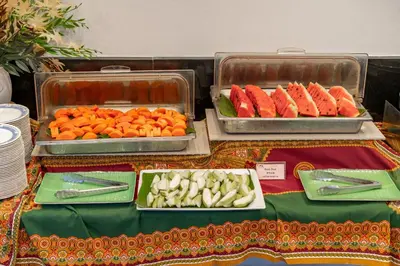 two trays of carrots and vegetables on a table at Ao Nang Timber House in Ao Nang Beach