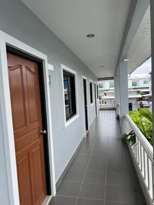 a hallway of a building with a door at J2 Airport Mansion in Nai Yang Beach