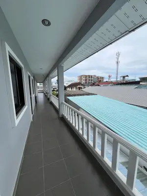 a view from the balcony of a house with a swimming pool at J2 Airport Mansion in Nai Yang Beach