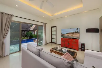 a living room with a couch and a table at Villa Adonara Private Pool Escape Near Nai Harn in Nai Harn Beach