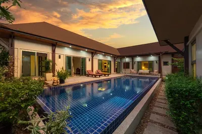 a swimming pool in the backyard of a house at Villa Adonara Private Pool Escape Near Nai Harn in Nai Harn Beach