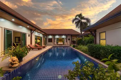a swimming pool in the backyard of a house at Villa Adonara Private Pool Escape Near Nai Harn in Nai Harn Beach