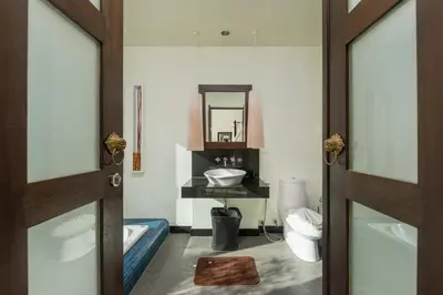 a bathroom with a sink and a mirror at Villa Adonara Private Pool Escape Near Nai Harn in Nai Harn Beach