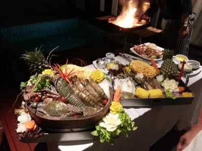 a table topped with lots of different types of food at Malisa Villa Suites - SHA Extra Plus in Kata Beach
