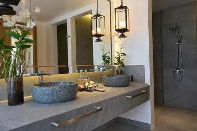 two sinks in a bathroom with a mirror at Malisa Villa Suites - SHA Extra Plus in Kata Beach