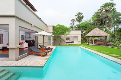 a swimming pool in the backyard of a villa at The Residence Resort in Bang Tao Beach