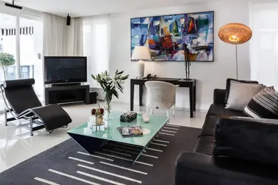 a living room with a couch and a coffee table at BYD Lofts - Boutique Hotel & Serviced Apartments - Patong Beach, Phuket in Patong Beach