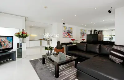 a living room with a couch and a coffee table at BYD Lofts - Boutique Hotel & Serviced Apartments - Patong Beach, Phuket in Patong Beach