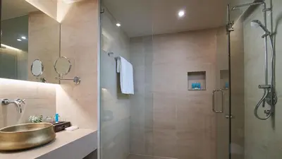 a bathroom with a sink and a shower at Amari Vogue Krabi in Tab Kaek Beach