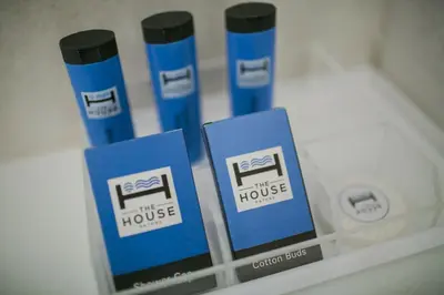 a display case with three blue boxes on a shelf at The House Patong in Patong Beach