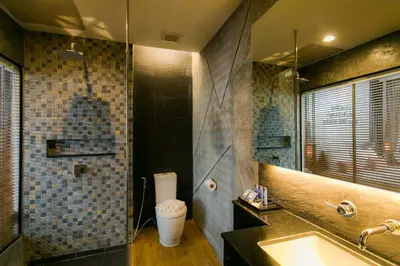 a bathroom with a sink and a shower and a toilet at The House Patong in Patong Beach