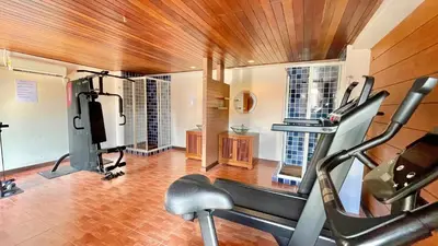 a fitness room with a gym with a treadmill at Baramee Resortel in Patong Beach