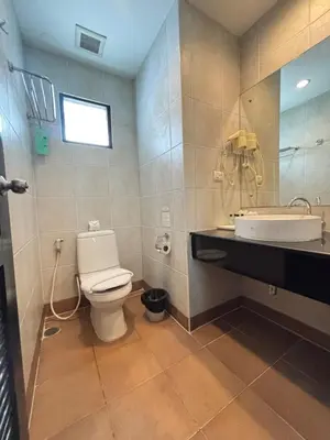 a bathroom with a toilet and a sink at Baramee Resortel in Patong Beach
