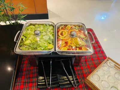 two trays of food sitting on top of a table at Baramee Resortel in Patong Beach
