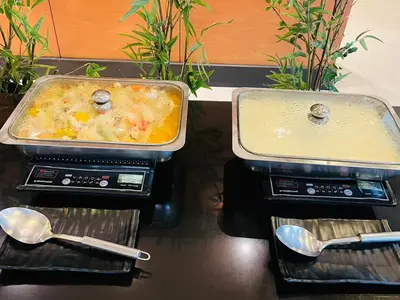 two trays of food sitting on top ofermott at Baramee Resortel in Patong Beach