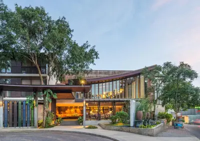 an exterior view of a building with a restaurant at Pakasai Resort in Ao Nang Beach