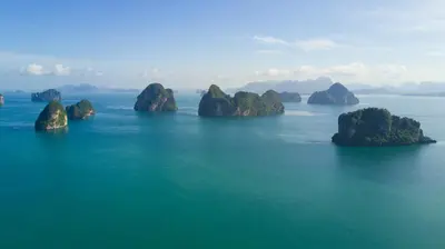 a group of small islands in the water at 9 Hornbills Tented Camp in Ko Yao Noi