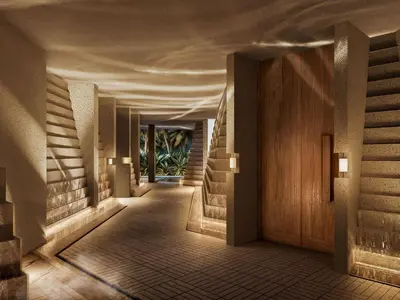 a hallway of a hotel with stairs and lights at Navera Phuket - MGallery Collection in Surin Beach