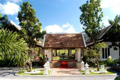 a house with a pathway leading to the front yard at Mission Hills Phuket Golf Resort-SHA Extra Plus in Por Bay