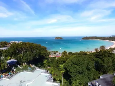 a view of the beach from a resort at Andaman Cannacia Resort & Spa - SHA Extra Plus in Kata Beach