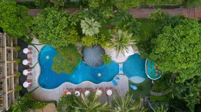 an aerial view of a resort with a swimming pool at Peach Hill Resort - SHA Extra Plus in Kata Beach