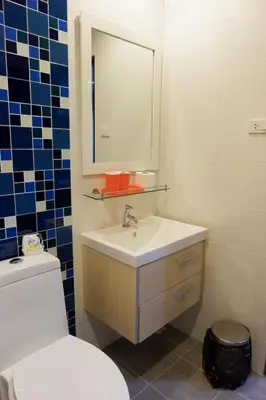 a bathroom with a toilet and a sink and a mirror at The Sea Condo Cozy Private Room at Ao nang Krabi in Ao Nang Beach
