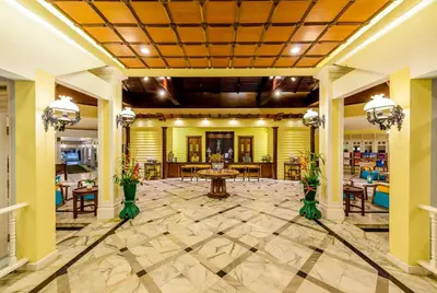 a lobby of a hotel with a table and chairs at Andaman Seaview, Karon Beach - SHA Plus in Karon Beach
