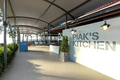 a building with a sign that reads plays kitchen at Sunwing Bangtao Beach in Bang Tao Beach