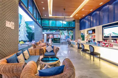 a lobby with couches and chairs in a store at The Beach Boutique House in Kata Beach