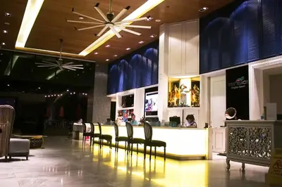 a restaurant with a bar with chairs and a counter at The Beach Boutique House in Kata Beach