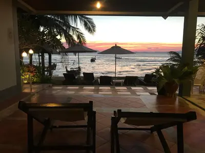 a view of the ocean from a resort with chairs and tables at Koh Kwang Seaview in Klong Muang Beach