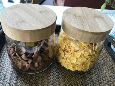 two mason jars filled with food on a table at Koh Kwang Seaview in Klong Muang Beach