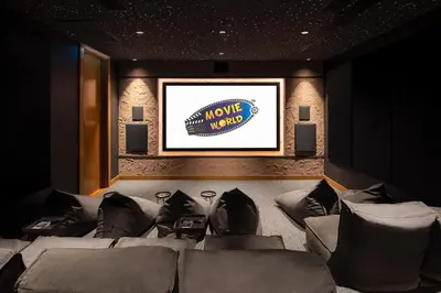 a movie room with a couch and a television at Holiday Inn Resort Phuket Surin Beach by IHG in Surin Beach