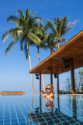 a woman in the water in a swimming pool at Barcelo Coconut Island, Phuket in Phuket Town