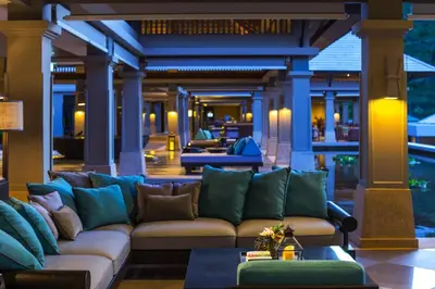 a living room with a couch on a porch at Phuket Marriott Resort and Spa, Nai Yang Beach in Nai Yang Beach