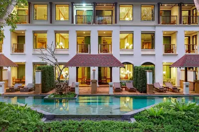 an exterior view of a hotel with a swimming pool at JW Marriott Phuket Resort and Spa in Mai Khao Beach