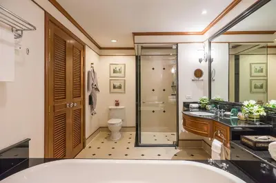 a bathroom with a tub and a shower and a toilet at JW Marriott Phuket Resort and Spa in Mai Khao Beach