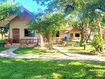 a house with a walkway in front of a yard at Mild Garden View Resort in Ao Nang Beach