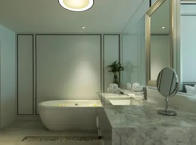 a bathroom with a tub and a sink and a mirror at Chanalai Romantica Resort - Adults Only, Kata Beach in Kata Beach