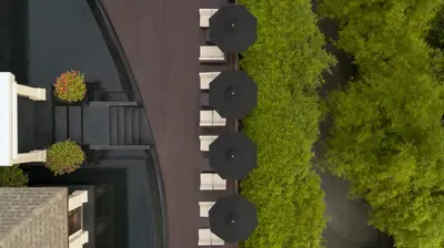 an overhead view of black umbrellas next to a building at The Pavilions Phuket in Bang Tao Beach