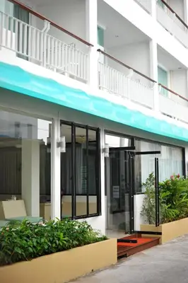 an external view of a building with windows and plants at Aspery Hotel in Patong Beach