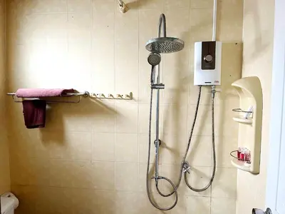 a shower with a shower head in a bathroom at Patong Lamai Residence in Patong Beach