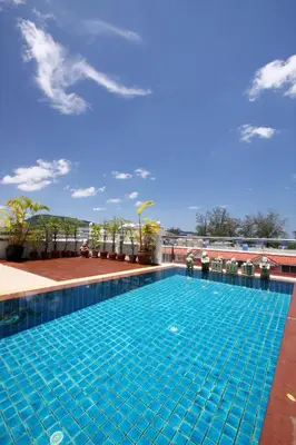 a swimming pool on top of a building at Rayaburi Hotel, Patong in Patong Beach