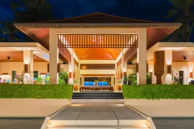 an exterior view of a villa at night at Dewa Phuket Resort & Villas, Nai Yang Beach in Nai Yang Beach