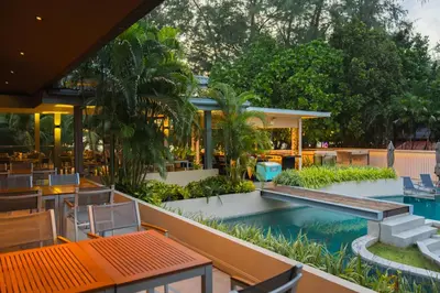 a resort with a swimming pool and a restaurant at Dewa Phuket Resort & Villas, Nai Yang Beach in Nai Yang Beach