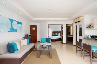 a living room with a couch and a table at Dewa Phuket Resort & Villas, Nai Yang Beach in Nai Yang Beach