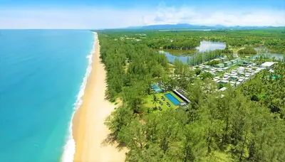an aerial view of a resort on a beach at SALA Phuket Mai Khao Beach Resort in Mai Khao Beach