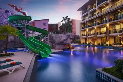 a pool with a water slide in a resort at Ananta Burin Resort in Ao Nang Beach