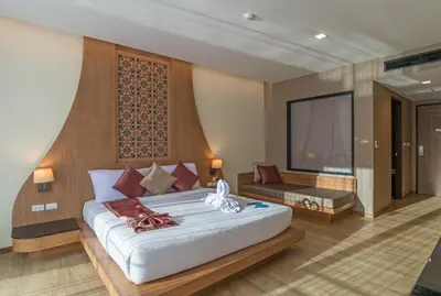 a bedroom with a large white bed in a room at Ananta Burin Resort in Ao Nang Beach