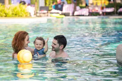 a group of people in a swimming pool at Holiday Ao Nang Beach Resort, Krabi in Ao Nang Beach